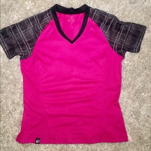 Pearl Izumi hot pink top with plaid sleeves